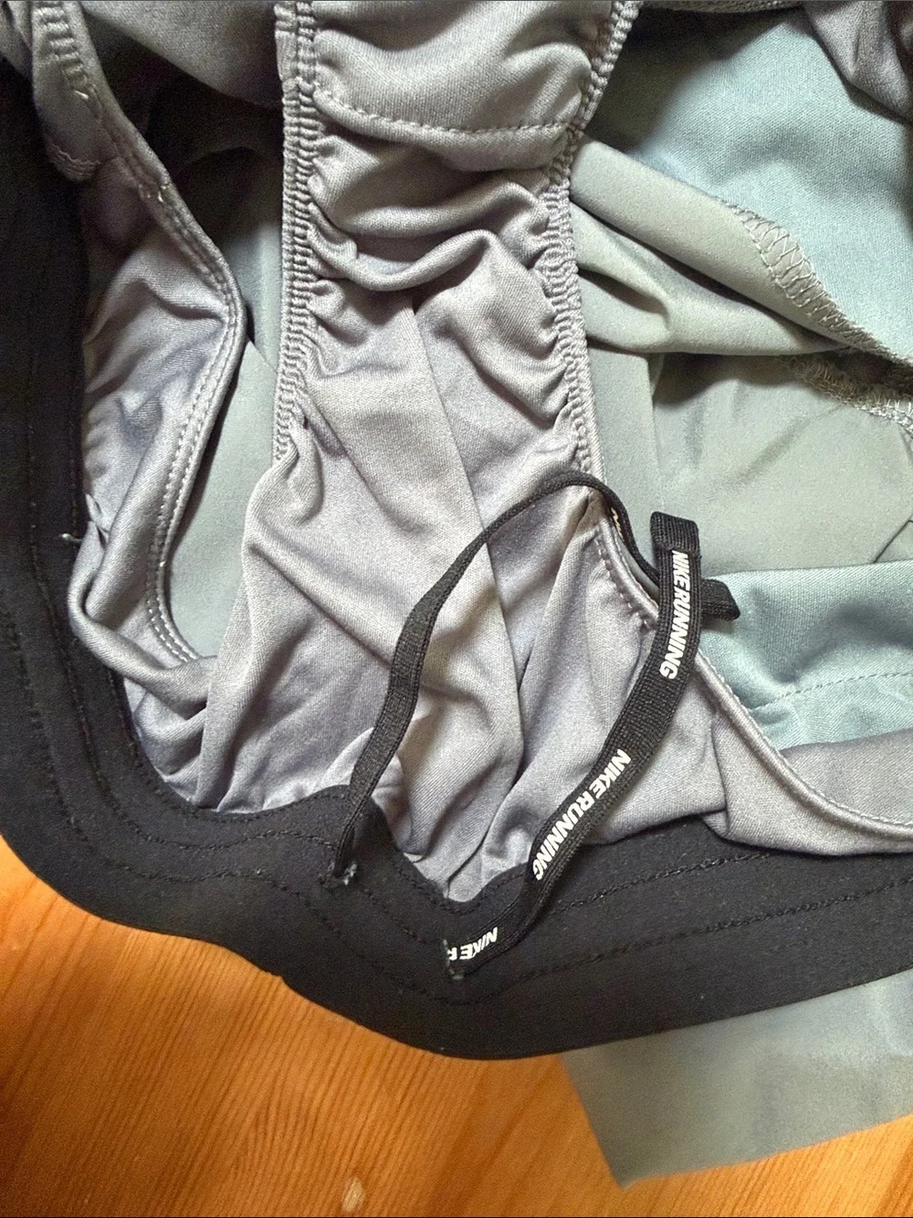 Nike Gray Athletic Shorts with Black Waistband and White Swoosh